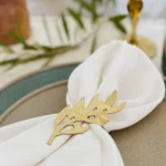 Olive Tree Leaves gold napkin rings with napkin _ blur bg